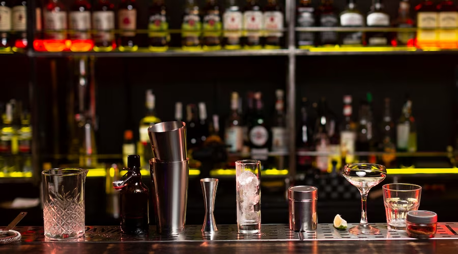 Bar Counter with Glasses and Bartending Tools